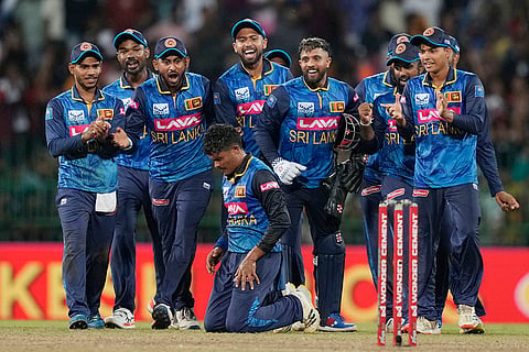 Jeffrey Vandersay gets on his knees as he celebrates after taking five wickets against India
